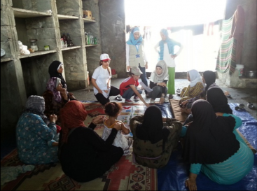 A group of mothers attend a hygiene promotion session at a shelter for displaced familiies on the outskirts of Tartous, Syria. Source: UNICEF (2013).